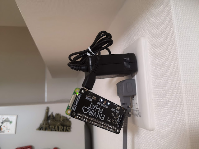 Final result after soldering enviro phat, setting up OS for rasp pi zero, and plugging in the power supply